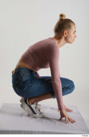  Kate Jones  1 blue jeans casual dressed kneeling pink long sleeve t shirt white sneakers whole body 0007.jpg